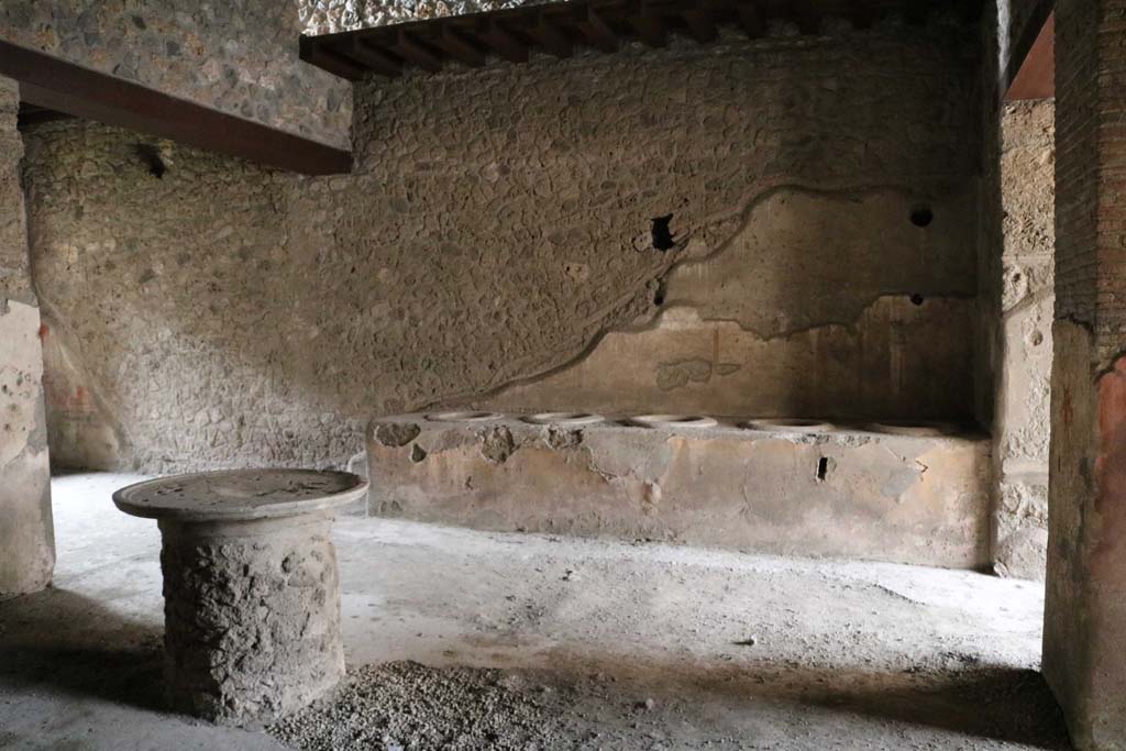 I.12.3 Pompeii, December 2018.
Looking west across room 1, towards counter leaning against west wall of courtyard. Photo courtesy of Aude Durand.