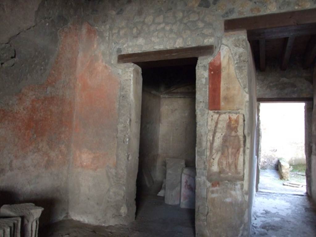 I.12.3 Pompeii. March 2009. Room 1, south-east corner of courtyard.
Doorway to room 2, and corridor to rear.
