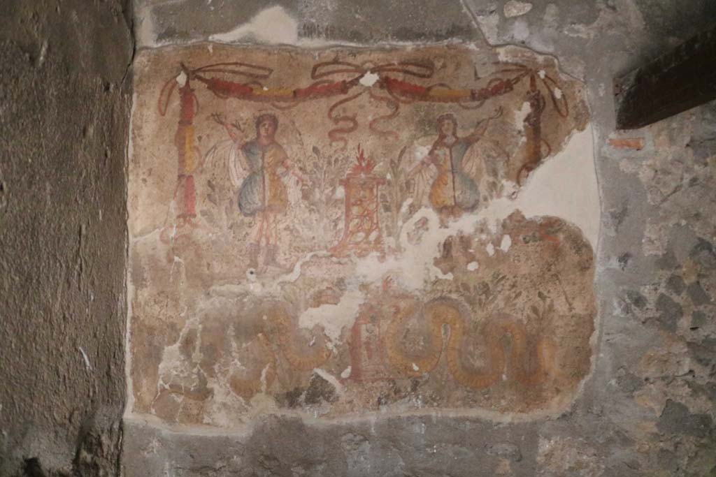 I.12.3 Pompeii. December 2018.
Room 4, painted lararium on east wall in north-east corner of kitchen. Photo courtesy of Aude Durand.