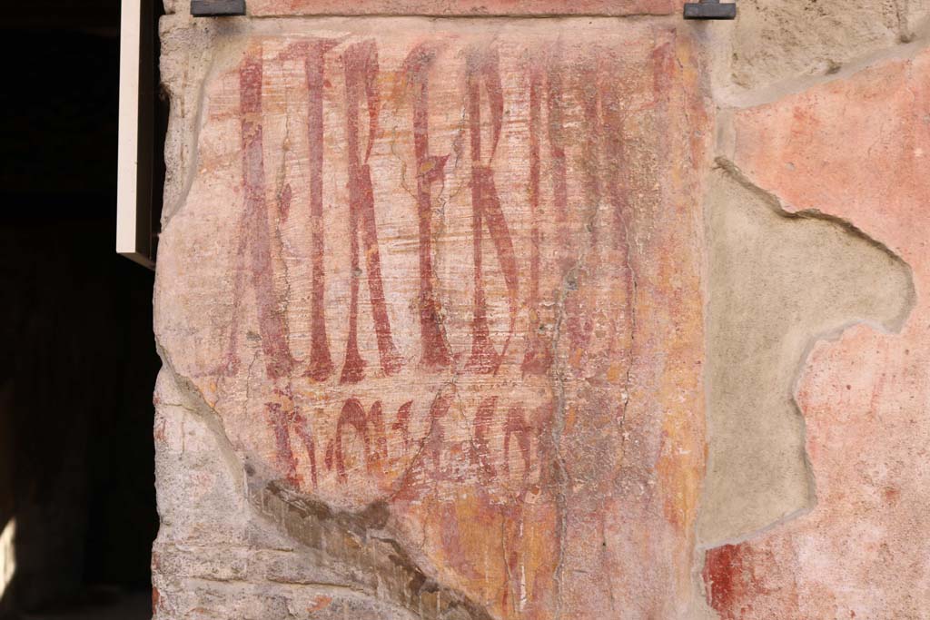 I.12.3 Pompeii, December 2018. Detail of graffiti on the west side of the doorway. Photo courtesy of Aude Durand.