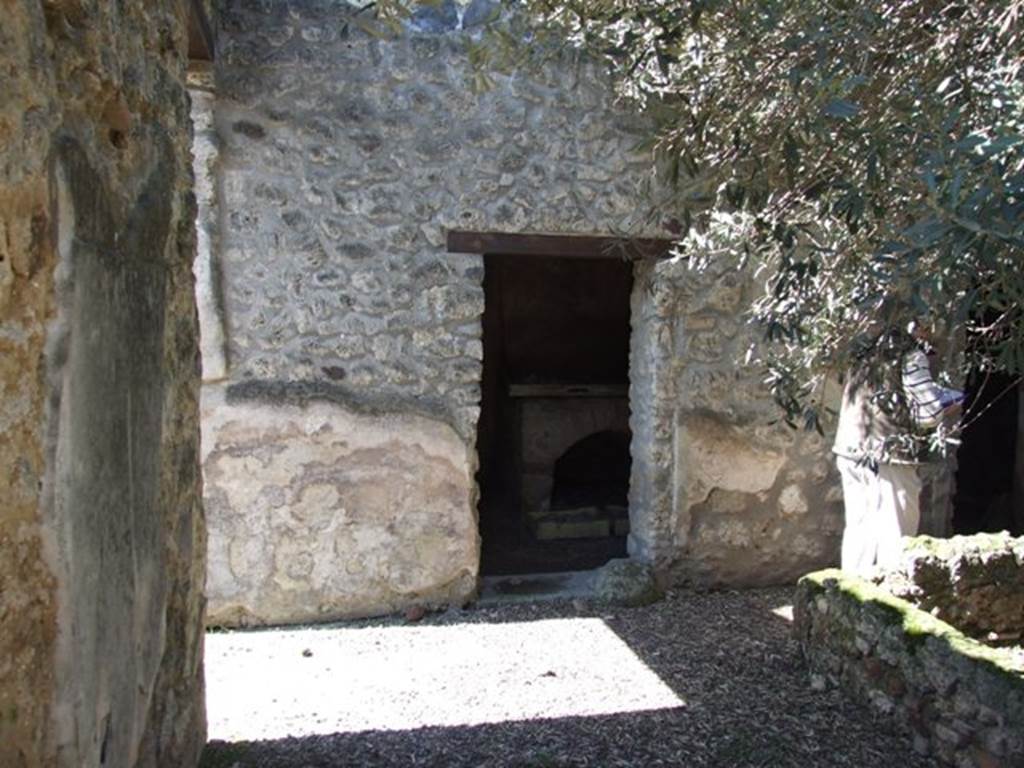 I.12.8 Pompeii. March 2009. West side of south portico, with doorway to room 10.