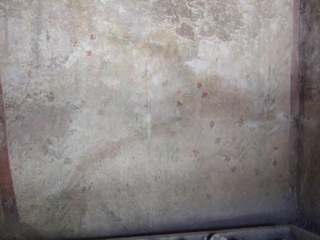 I.12.8 Pompeii. March 2009. Room 10. West wall. Remains of Lararium, painted with plants and birds. The legs of the Lares used to be visible at the top of the wall, but only their booted legs, the upper parts were destroyed.
See Giacobello, F., 2008. Larari Pompeiani: Iconografia e culto dei Lari in ambito domestico. Milano: LED Edizioni. (p.152-3).