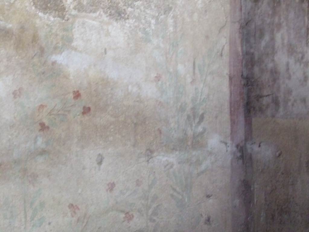 I.12.8 Pompeii. March 2009. Room 10. West wall. Lararium. Remains of painted plant decoration.