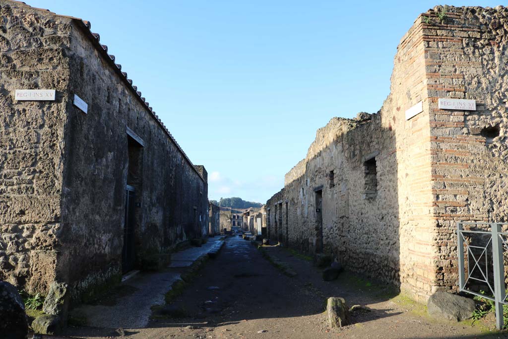Via Castricio, Pompeii. December 2018.
Looking west between I.15 and 1.12, from the junction with Vicolo dei Fuggiaschi, with I.12.8 on right. Photo courtesy of Aude Durand.