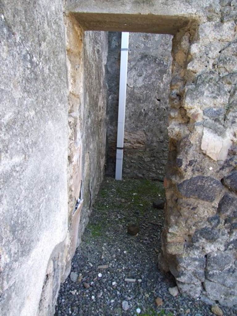 I.12.8 Pompeii. March 2009. Doorway to room 4, on west side of entrance door.