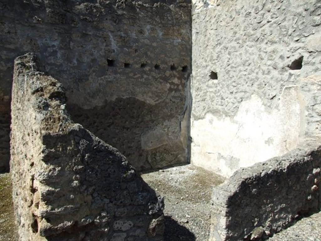 I.12.8 Pompeii. March 2009. Doorway to room 6 and north west corner.