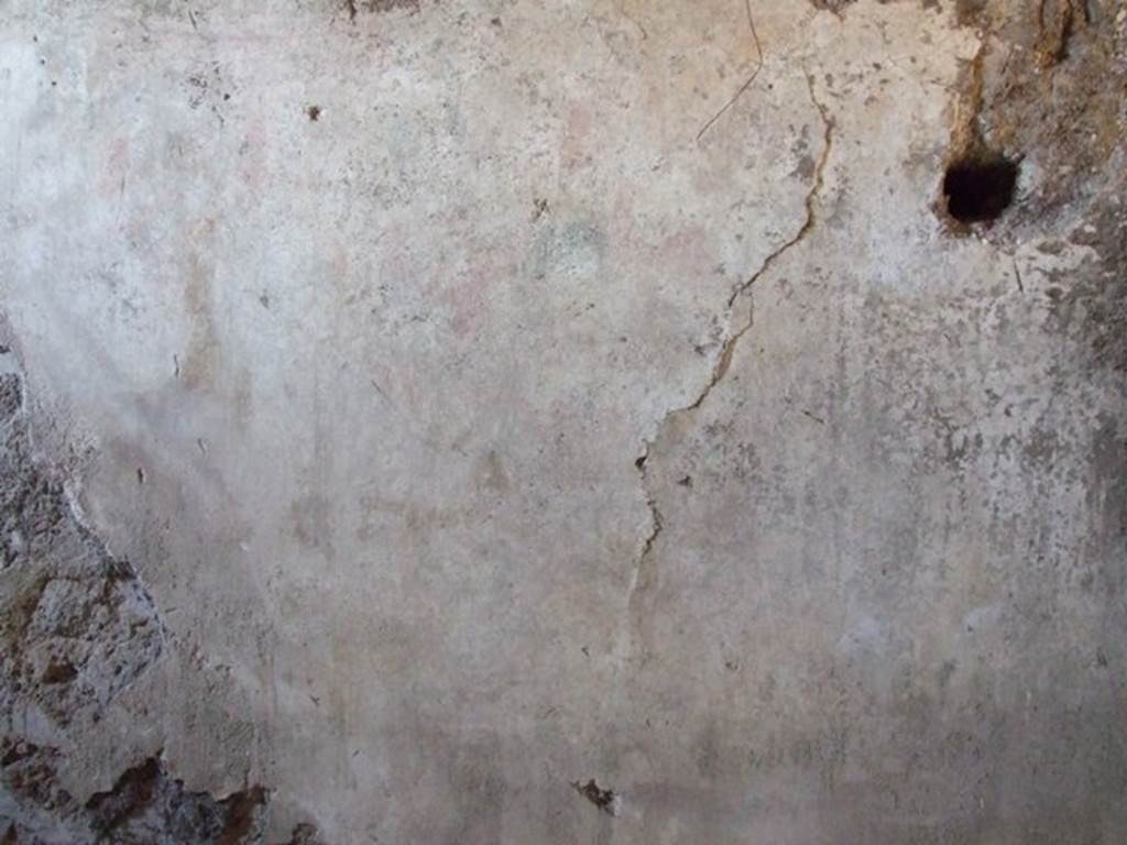 I.12.9 Pompeii. December 2007. East wall of kitchen. According to PPP and Giacobello, on the east wall of the kitchen above the bench was a lararium, now completely disappeared. According to PPP, the Lararium was shown with altar, offerings, a Lar, and a decayed serpent.
According to Giacobello, in the upper part was the figure of the Genius sacrificing near an altar. He was assisted by two people, presumably the camillo and the tibicine. On his left, was a painted Lar with his arm held high, near to him was a large ham. Upon discovery, the serpent near an altar in the lower zone was only partially conserved. See Giacobello, F., 2008. Larari Pompeiani: Iconografia e culto dei Lari in ambito domestico. Milano: LED Edizioni. (p.153) See Bragantini, de Vos, Badoni, 1981. Pitture e Pavimenti di Pompei, Parte 1. Rome: ICCD. (p.176)