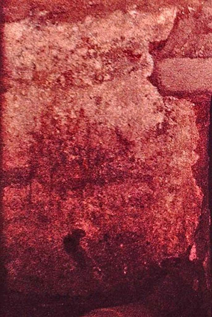 I.12.11 Pompeii. 1964. Lararium painting on west wall of kitchen, above hearth.
It appears to show a rectangular base on top of which may be a group of people/objects/plants all under a garland.
Detail from photo by Stanley A. Jashemski.
Source: The Wilhelmina and Stanley A. Jashemski archive in the University of Maryland Library, Special Collections (See collection page) and made available under the Creative Commons Attribution-Non Commercial License v.4. See Licence and use details.
J64f1956