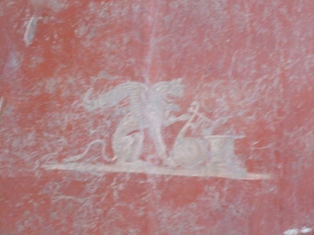 I.12.11 Pompeii. December 2007.
Painted panel of attributes of Apollo (Griffin and lyre leaning against an altar) from east end of south wall of triclinium.