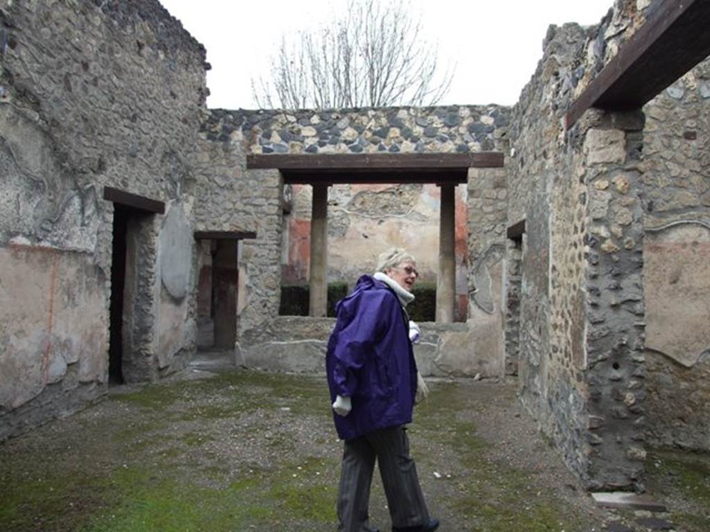 I.12.11. December 2007. Atrium, looking north to tablinum area with window overlooking garden.