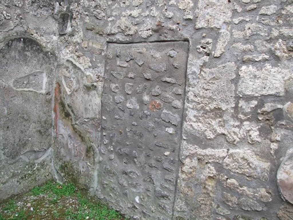 I.12.11. Blocked door to I.12.12 in west wall of atrium. December 2006.