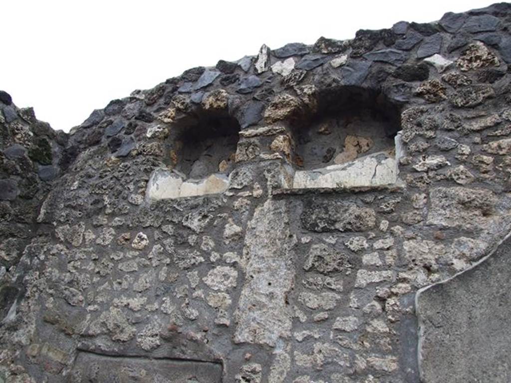I.12.11. Niches on west wall of atrium above blocked door to I.12.12. December 2006.