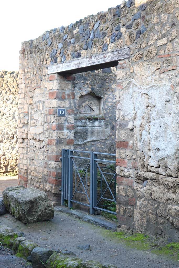 I.12.12 Pompeii. December 2018.
Entrance doorway on north side of Via di Castricio. Photo courtesy of Aude Durand.