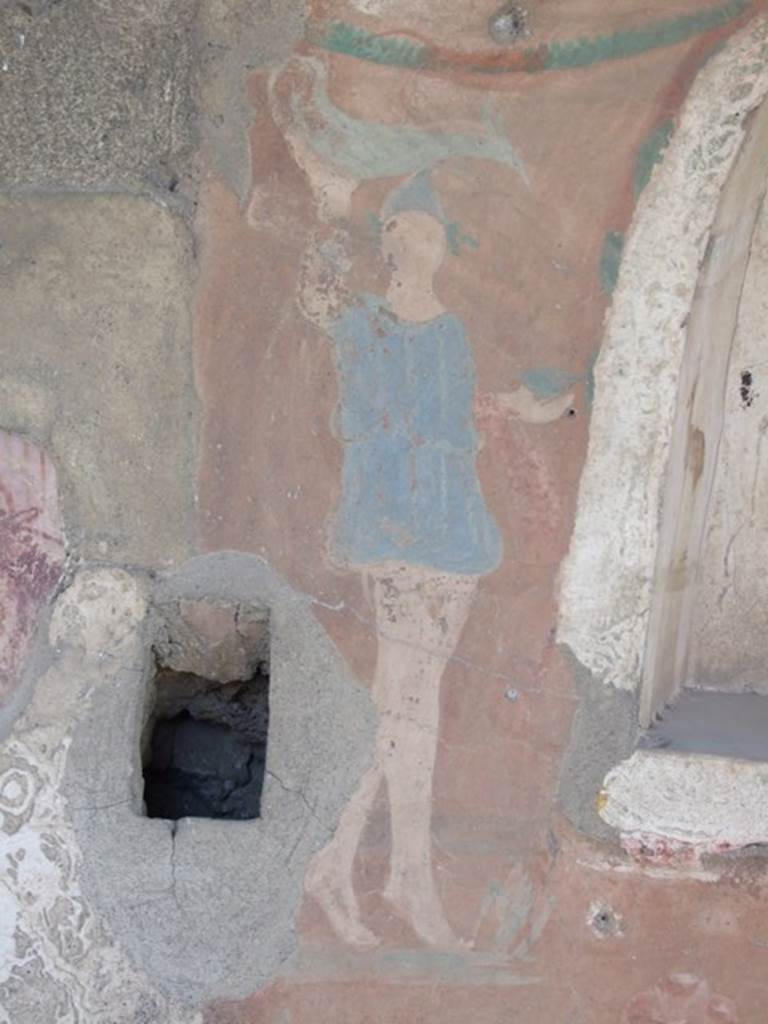 I.12.15 Pompeii. March 2009. North side of Lararium niche. Lar with painted garland above his head.