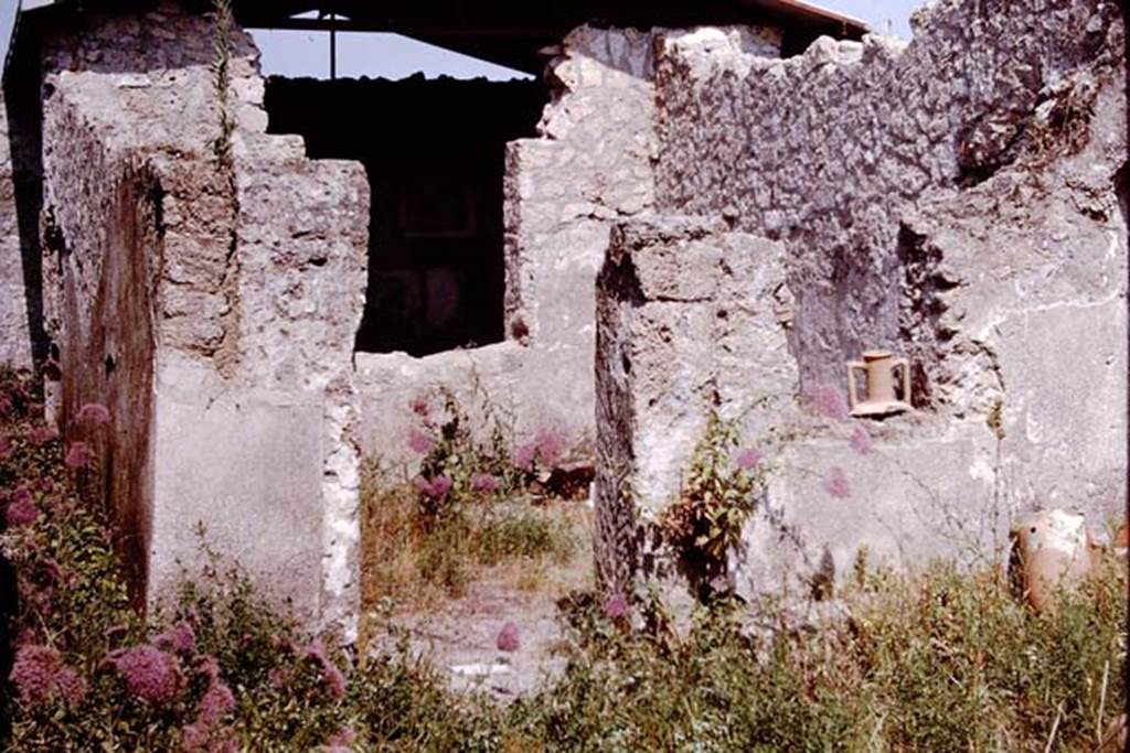 I.12.15 Pompeii. 1964. Looking east in atrium to doorway to room 3, windowed triclinium, in centre, and room 4, corridor, on left. Photo by Stanley A. Jashemski.
Source: The Wilhelmina and Stanley A. Jashemski archive in the University of Maryland Library, Special Collections (See collection page) and made available under the Creative Commons Attribution-Non Commercial License v.4. See Licence and use details.
J64f1568