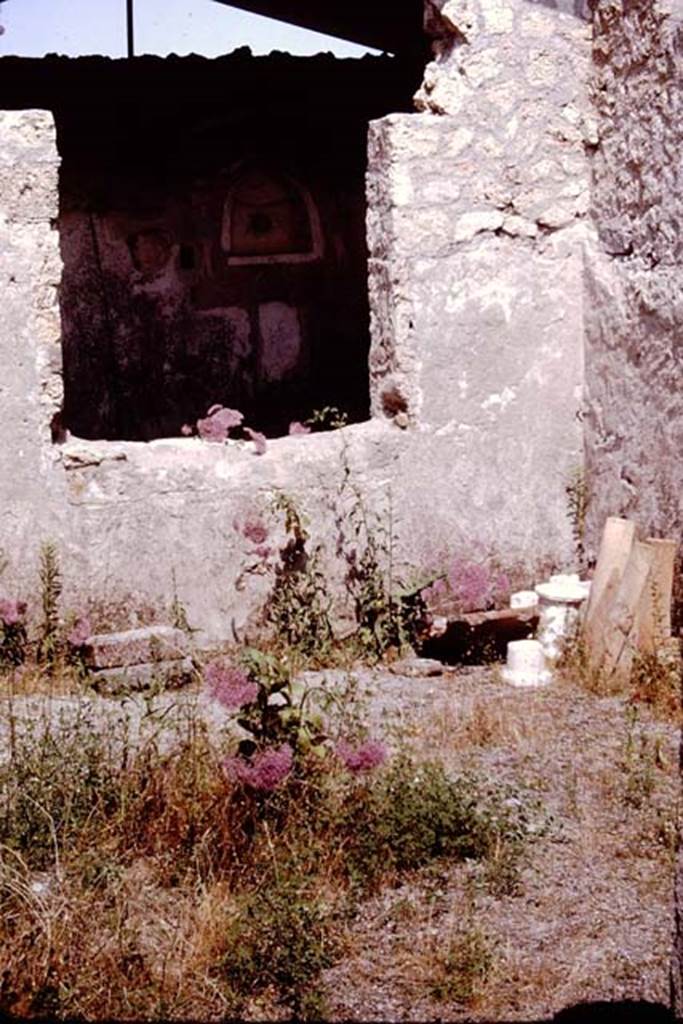 I.12.15 Pompeii. 1964. Window in east wall looking towards the lararium niche in the outdoor triclinium. Photo by Stanley A. Jashemski.
Source: The Wilhelmina and Stanley A. Jashemski archive in the University of Maryland Library, Special Collections (See collection page) and made available under the Creative Commons Attribution-Non Commercial License v.4. See Licence and use details.
J64f1570