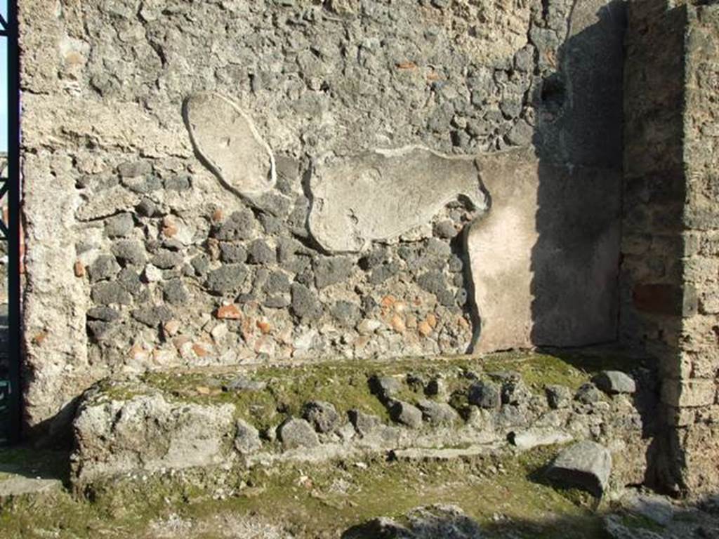 I.12.16 Pompeii. December 2007. Wall and bench to south of entrance.