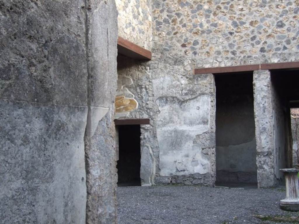 I.13.2 Pompeii. December 2007.
Looking south-east across atrium towards small doorway on south wall of ala leading to an anteroom before an oecus, and large doorway to a small closed tablinum.