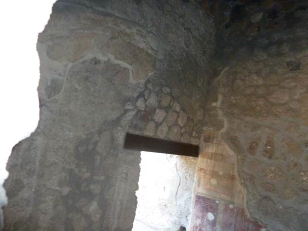 I.13.2 Pompeii, September 2015. South wall of anteroom, with small doorway to oecus. Taken through window from I.13.3.