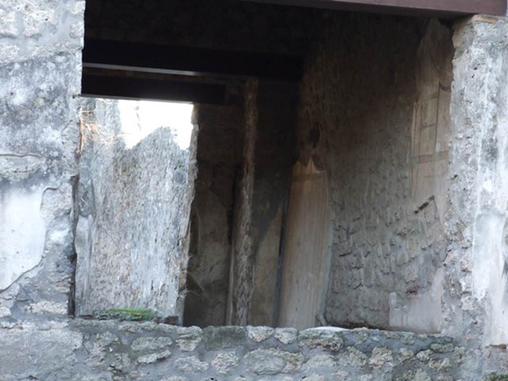 I.13.2 Pompeii. December 2007. West wall of Triclinium with large window onto atrium and access at rear to garden area with outside Triclinium.