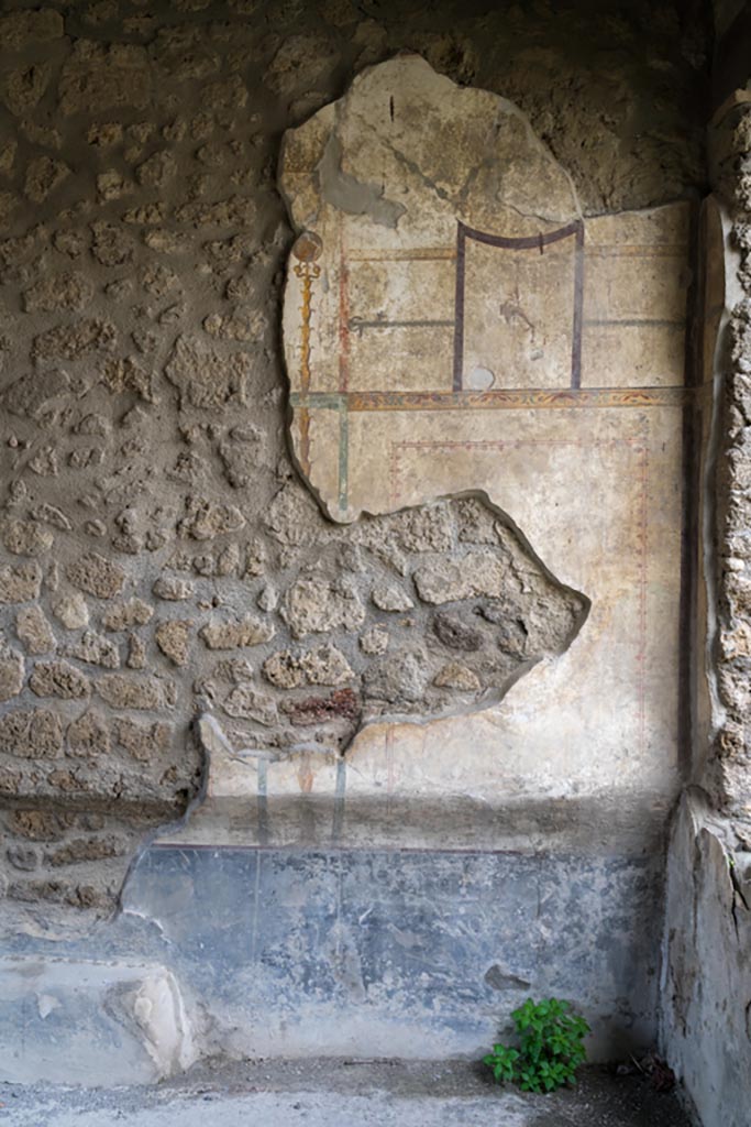 I.13.2 Pompeii. March 2023.
Detail from north end of west wall in triclinium. Photo courtesy of Johannes Eber.