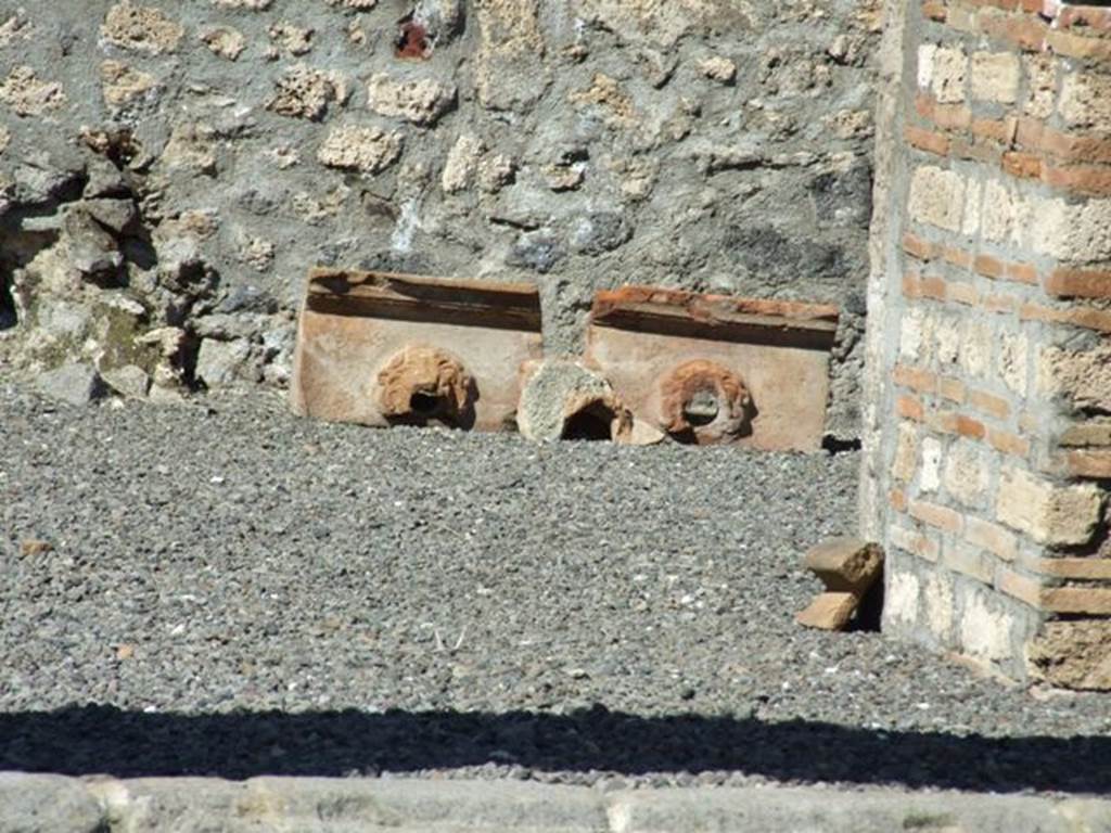 I.13.12 Pompeii. March 2009.  Remains of Grondaia, or Antefisse fittili, or Sima, or water spouts.