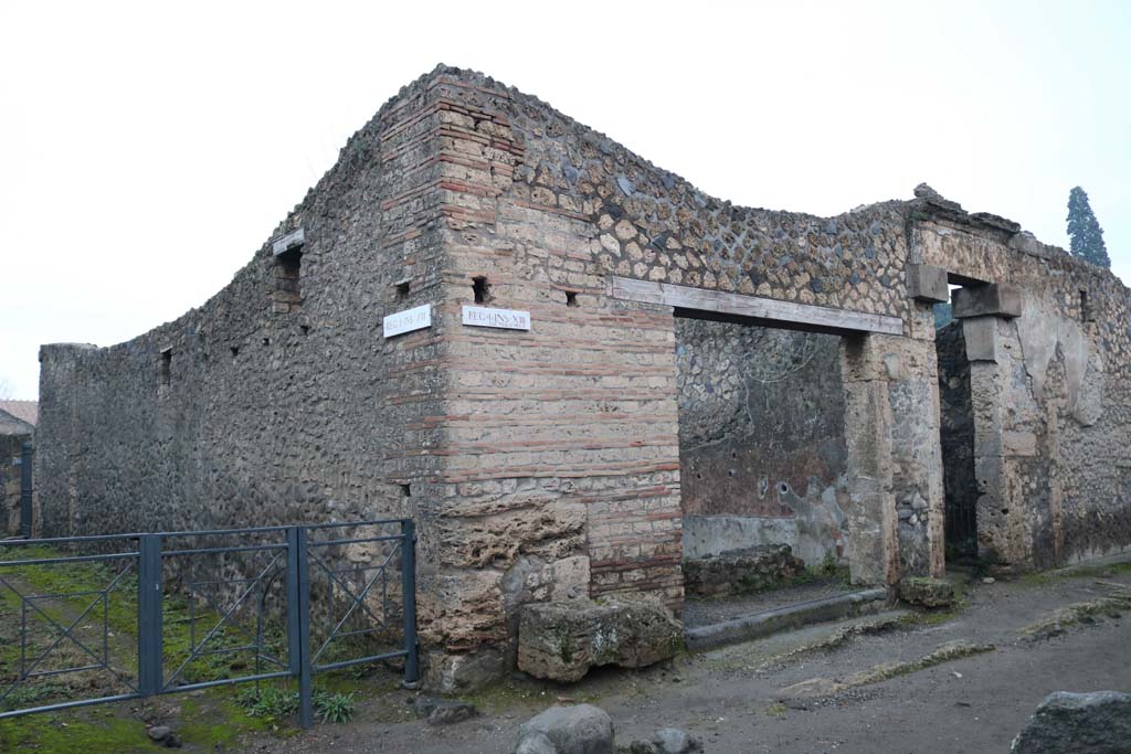 I.13.13, Pompeii, and I.13.12, on right. December 2018.
Looking towards entrance doorways on north side of Via di Castricio. Photo courtesy of Aude Durand.