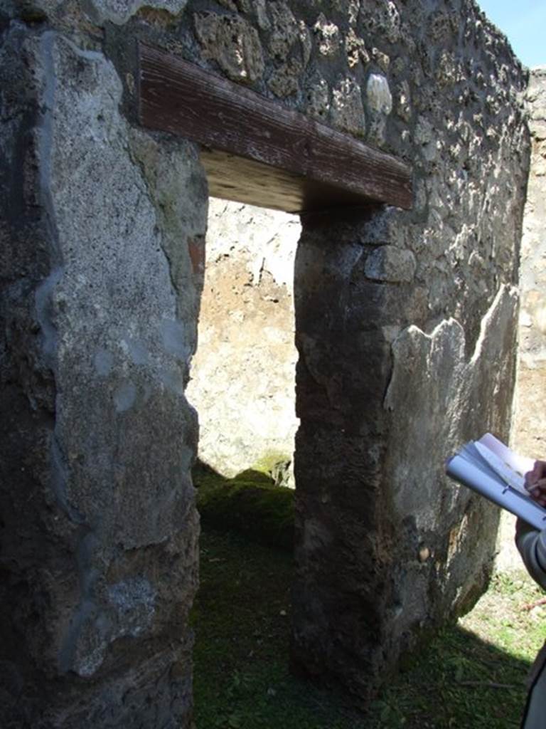 I.13.15 Pompeii. March 2009. Doorway to Room on north side of entrance. Looking west.