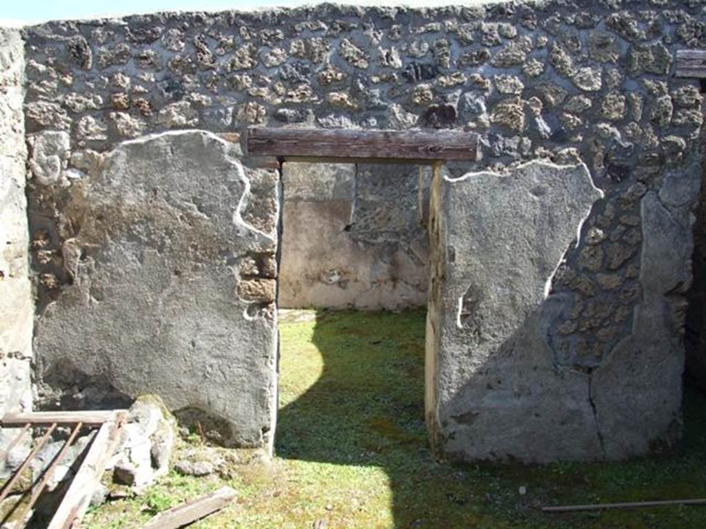 I.13.15 Pompeii. March 2009. Doorway in east wall of central courtyard, at north end.