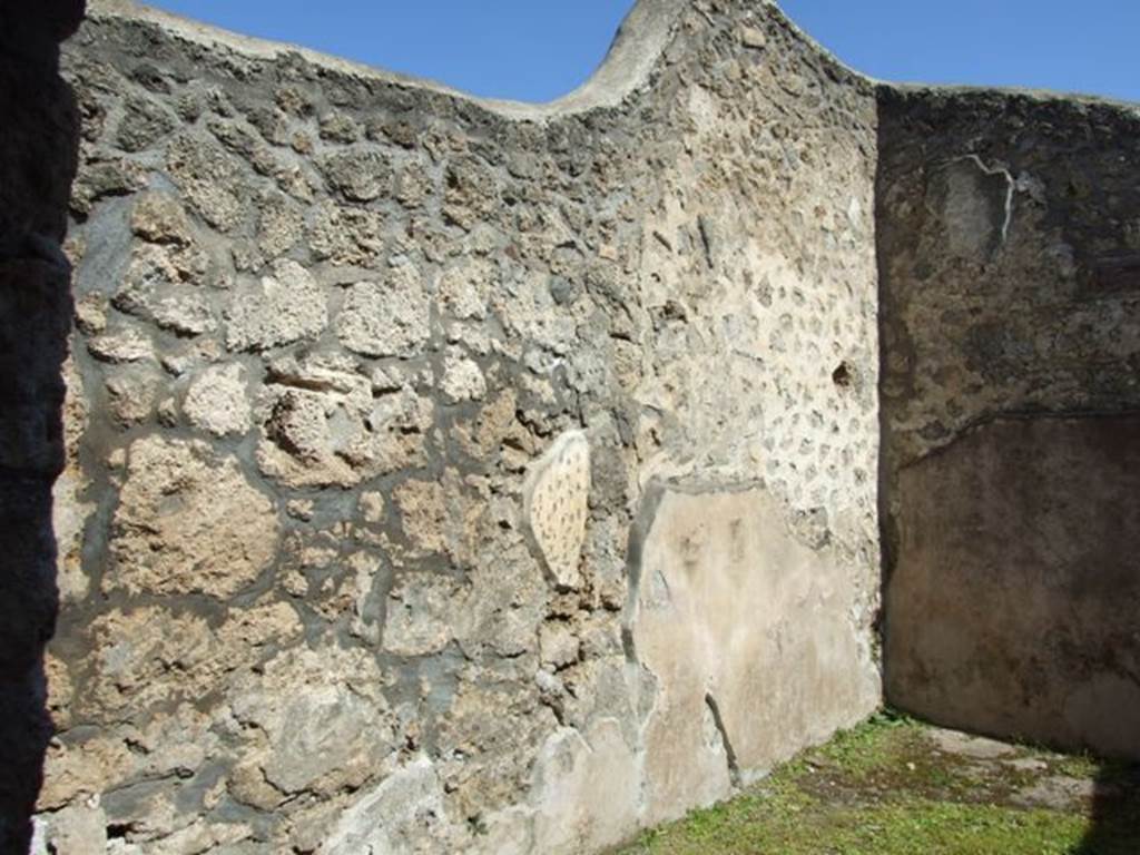I.13.15 Pompeii. March 2009. Room on north-east side of central courtyard, looking at north-east corner and north wall.