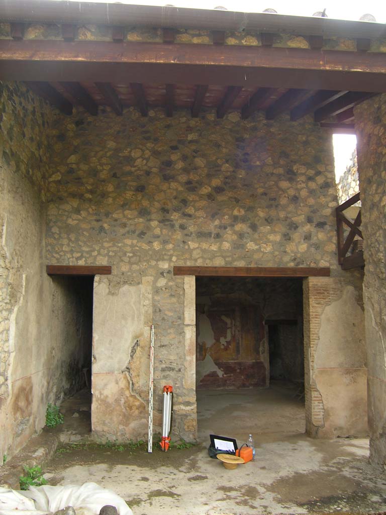 I.14.2 Pompeii. July 2008. Looking east to doorways to corridor K, and room H, in area L, on east side of garden area.
Photo courtesy of Guilhem Chapelin.