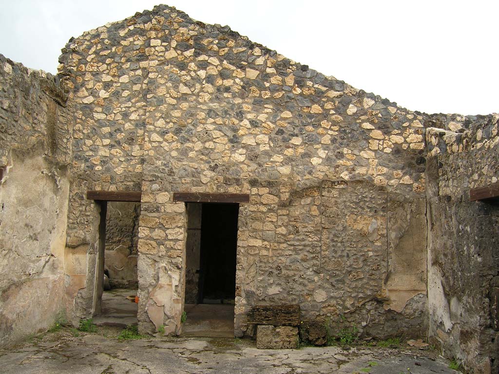 I.14.2 Pompeii. July 2008. Room B, looking north across atrium.
On the left is the doorway to room L, in the centre is the doorway to room H.
Photo courtesy of Guilhem Chapelin.