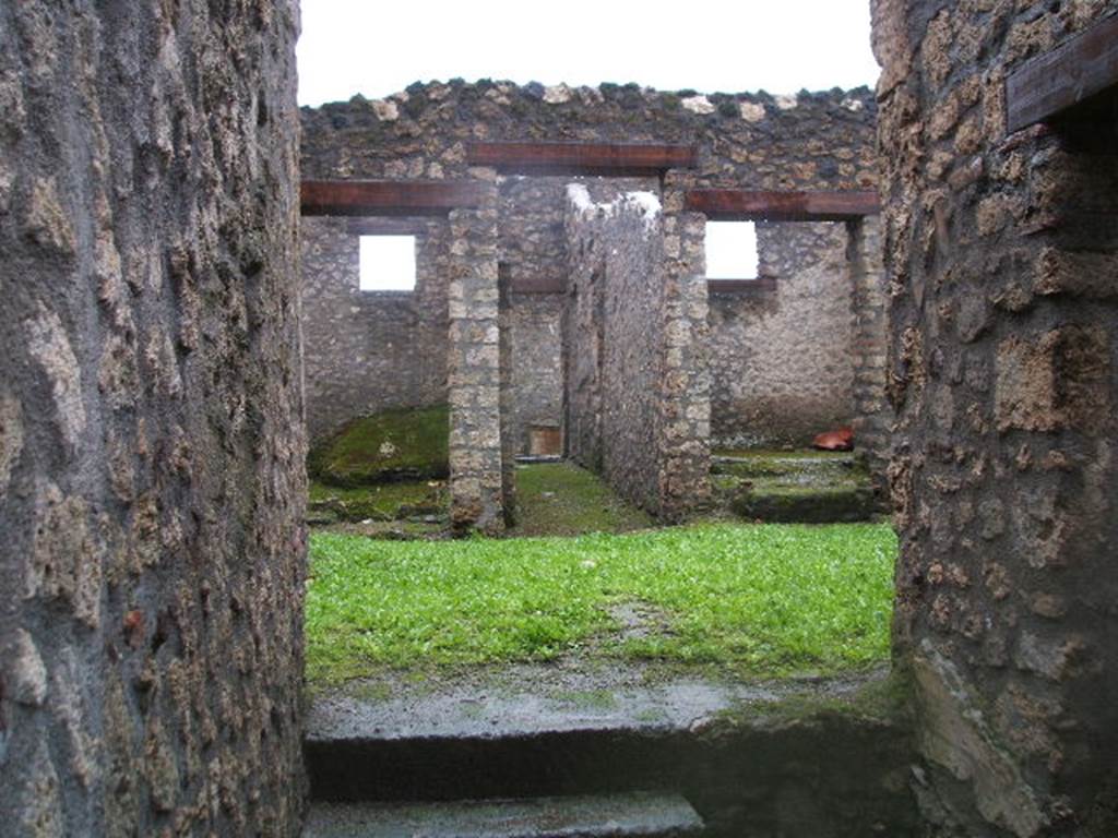 I.14.3 Pompeii. December 2005.
Looking west across atrium to doorways to oecus, garden area and triclinium.
