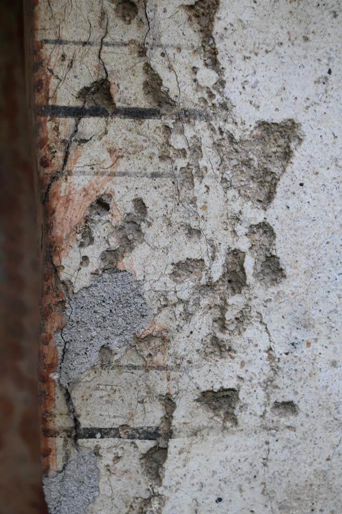 I.14.7 Pompeii. December 2018.
Detail of the wall at the north end of the lararium on west wall of the garden area. Photo courtesy of Aude Durand.