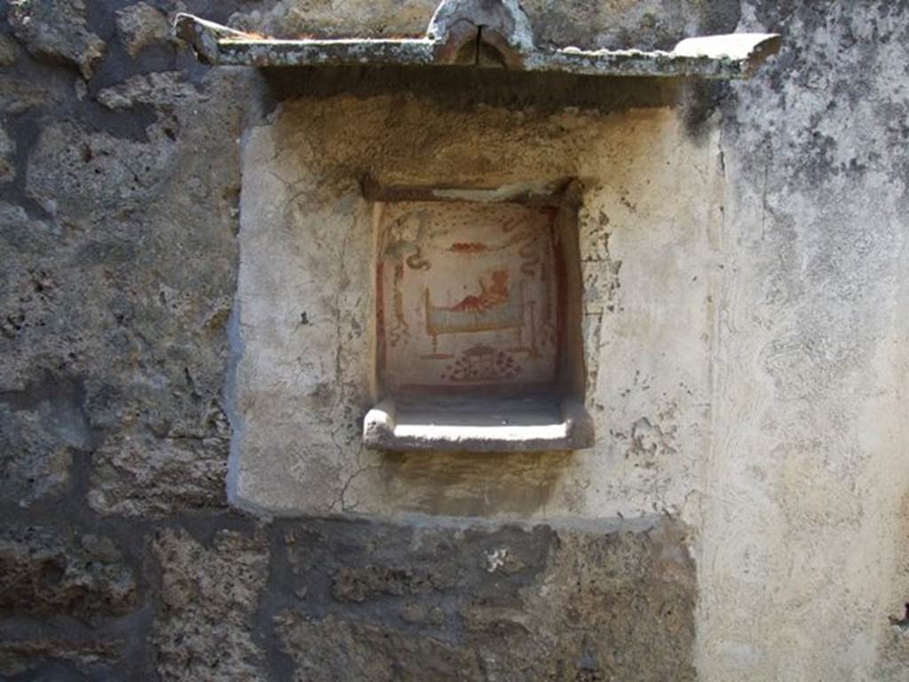 I.14.7 Pompeii. March 2009. Niche lararium on west wall of garden area.
