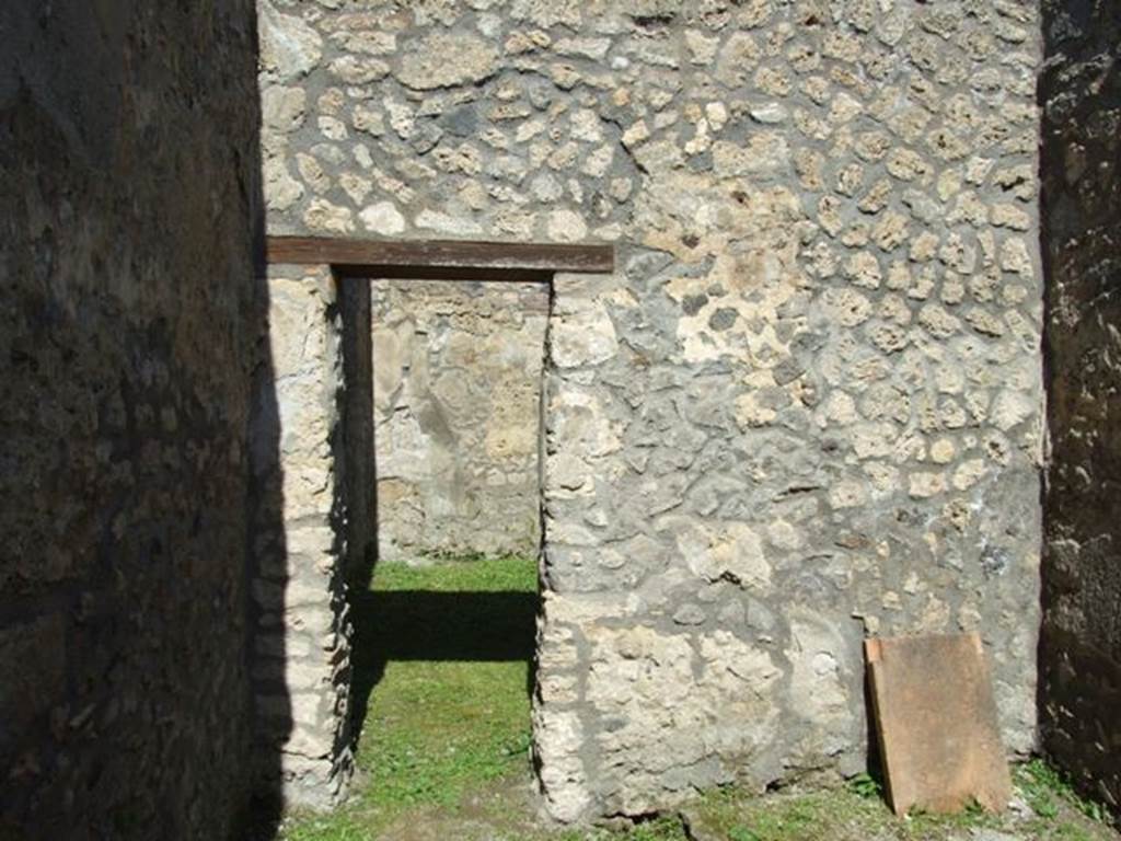 I.14.7 Pompeii. March 2009. Windowed triclinium, north wall with door to south west corner of atrium.