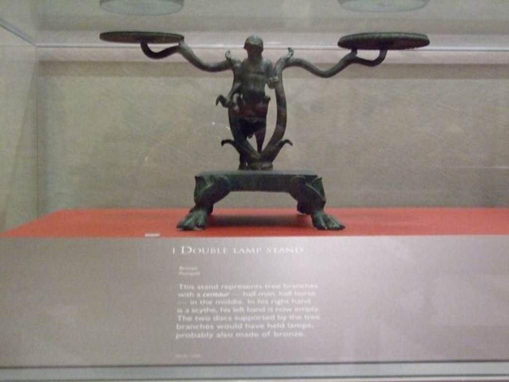 I.14.9 Pompeii. Bronze double lamp stand in the shape of a tree with a centaur in the centre. SAP 12088. Photographed at “A Day in Pompeii” exhibition at Melbourne Museum. September 2009.