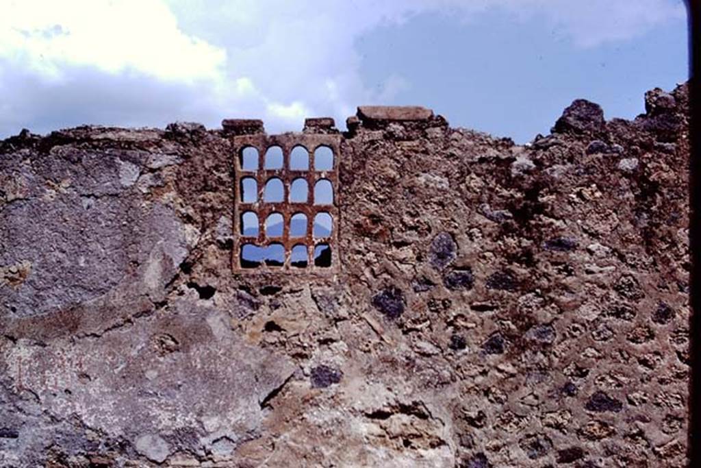 I.14.11 Pompeii. 1972. Terracotta window on east side of entrance doorway, in front exterior wall. Photo by Stanley A. Jashemski.
Source: The Wilhelmina and Stanley A. Jashemski archive in the University of Maryland Library, Special Collections (See collection page) and made available under the Creative Commons Attribution-Non Commercial License v.4. See Licence and use details. J72f0219
