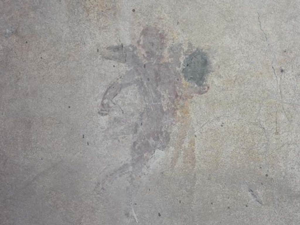 I.14.12, Pompeii. May 2018. Room 2, painted flying cupid detail from north wall at west end.
Photo courtesy of Buzz Ferebee