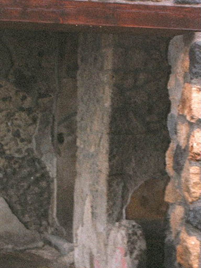 I.14.12 Pompeii. December 2004.
Room 32, two doorways, to rooms 13, on left, and room 34,on right, on east side of peristyle, taken from I.14.13