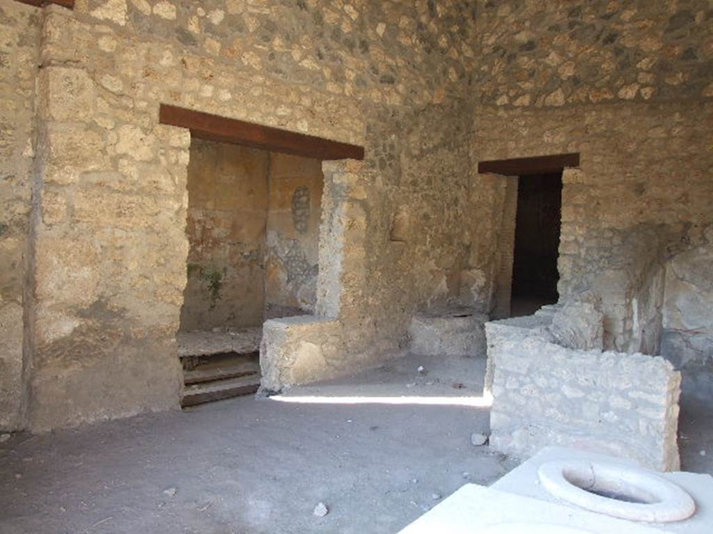 I.14.15 Pompeii. December 2006. West side of bar, with doorways to rooms on west and north side.