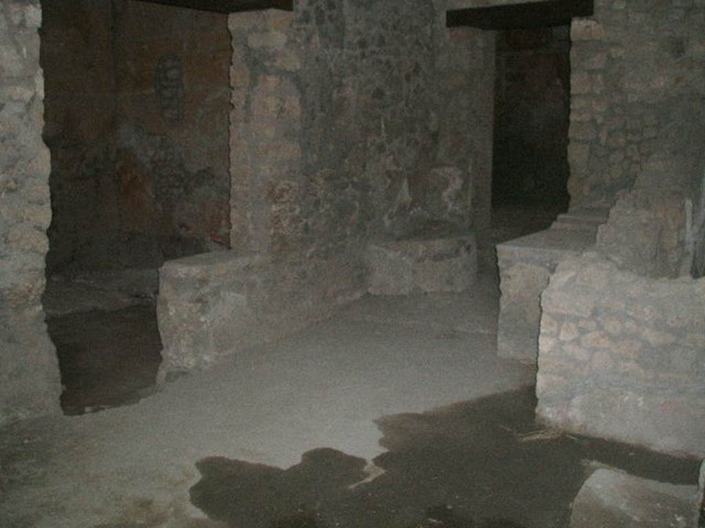 I.14.15 Pompeii. December 2004. West side of bar, with doorways to rooms on west and north side.