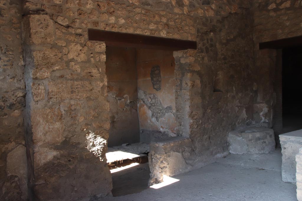 I.14.15 Pompeii. October 2022.
Looking towards west side of bar-room with doorways to room on west side, in centre. Photo courtesy of Klaus Heese.