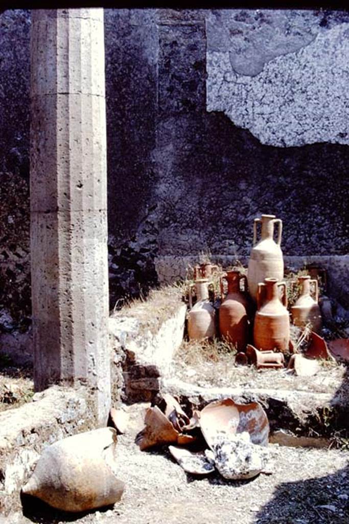 I.15.3 Pompeii. 1972. Pots and amphorae at east end of south portico 10 in peristyle 13. Photo by Stanley A. Jashemski.
Source: The Wilhelmina and Stanley A. Jashemski archive in the University of Maryland Library, Special Collections (See collection page) and made available under the Creative Commons Attribution-Non Commercial License v.4. See Licence and use details. J72f0639