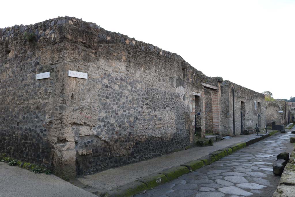 I.16.1 Pompeii, centre left. December 2018.
Looking west along north side of insula between I.16.1 to I.16.4. Photo courtesy of Aude Durand.