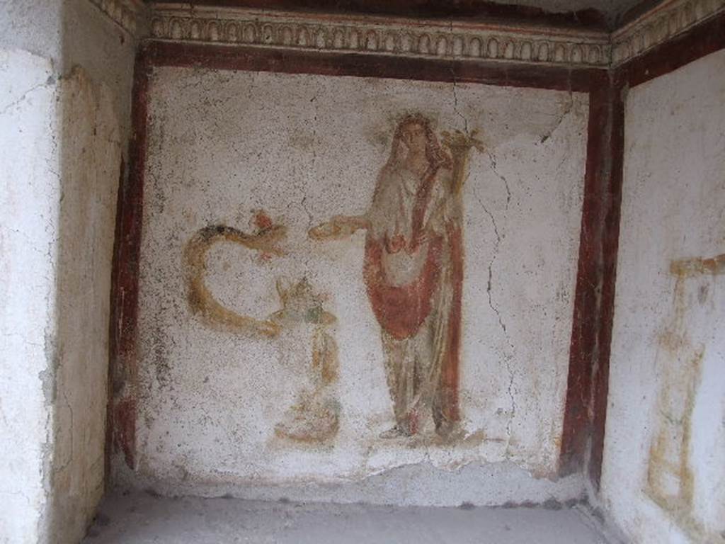 I.16.3 Pompeii. December 2006. West wall in lararium. Detail of painting of Genius with serpent winding around a round altar. See Fröhlich, T., 1991. Lararien und Fassadenbilder in den Vesuvstädten. Mainz: von Zabern, L35 p. 264, taf. 5,2.