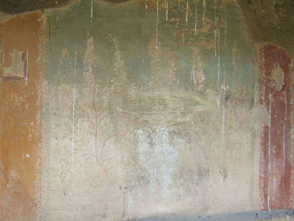 I.17.4 Pompeii. May 2006. Garden painting on central panel at east end of north wall of peristyle garden. A circular fountain supported by winged sphinxes. See Jashemski, W. F., 1993. The Gardens of Pompeii, Volume II: Appendices. New York: Caratzas. (p.328).