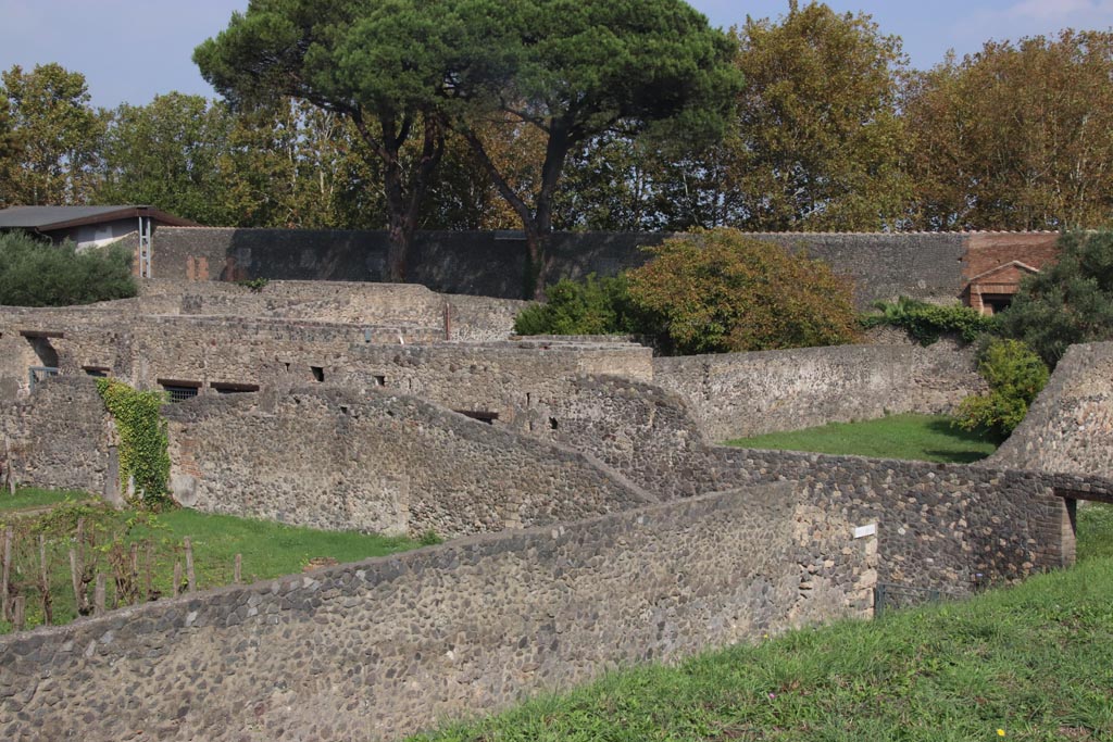 I.20.1 Pompeii. October 2023.
Looking towards east wall of garden in south-east corner, with Via di Nocera near Nocera Gate, on right. Photo courtesy of Klaus Heese.