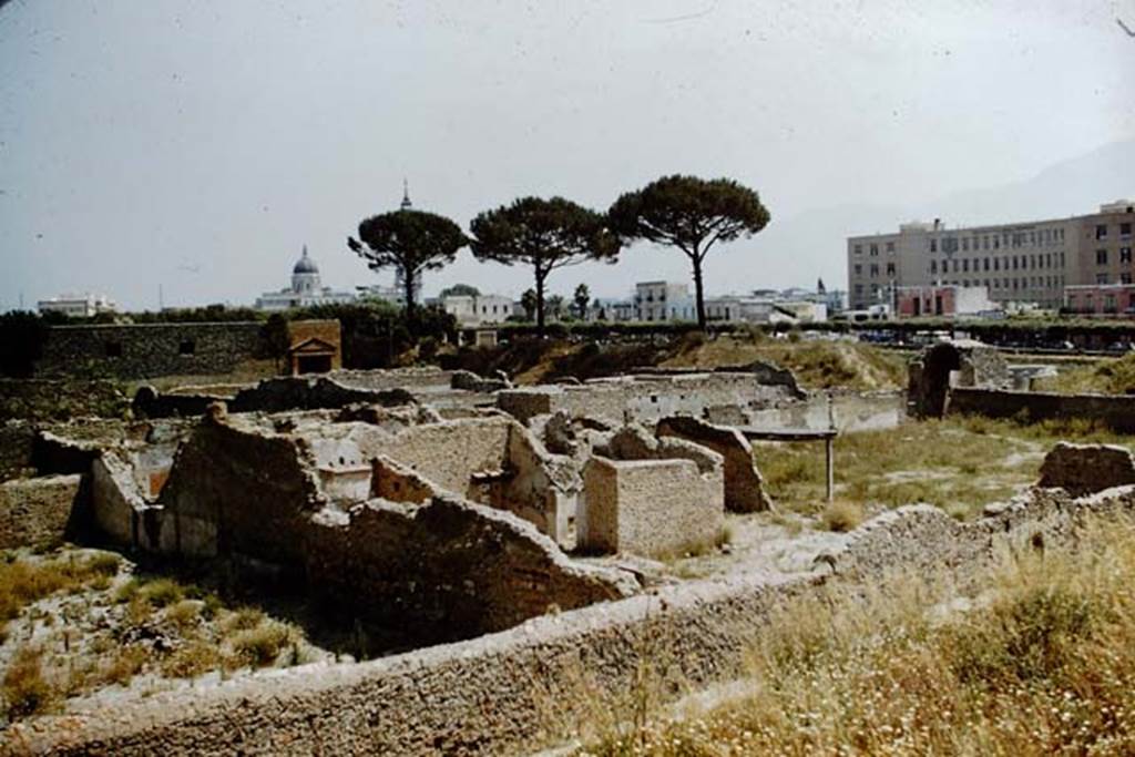 1.20.1 Pompeii. 1959. Looking south-east across southern end of I.20 towards new Pompeii. The garden of 1.20.1/2, and the rears of I.20.3/4 can be seen. The Nocera gate can be seen on the centre right. On the left is the south end of the vineyard at I.20.5
Photo by Stanley A. Jashemski.
Source: The Wilhelmina and Stanley A. Jashemski archive in the University of Maryland Library, Special Collections (See collection page) and made available under the Creative Commons Attribution-Non Commercial License v.4. See Licence and use details.
J59f0463