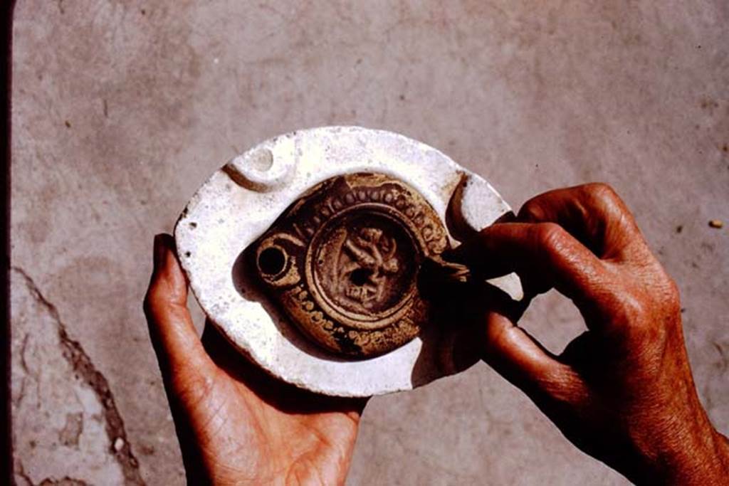 I.20.3 Pompeii. 1972. Example of lamp in a mould. Photo by Stanley A. Jashemski.
Source: The Wilhelmina and Stanley A. Jashemski archive in the University of Maryland Library, Special Collections (See collection page) and made available under the Creative Commons Attribution-Non Commercial License v.4. See Licence and use details. J72f0115